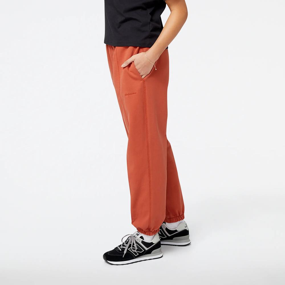 Spodnie New Balance WP23553MHY - brązowe