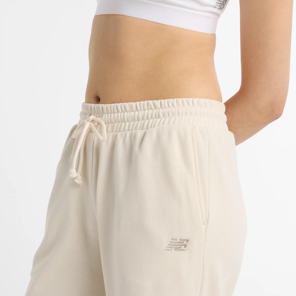 Spodnie damskie New Balance WP51503LIN - beżowe
