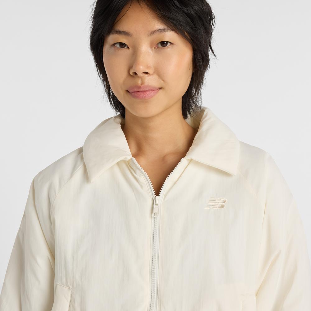 Kurtka damska New Balance WJ61D8YXSST - beżowa