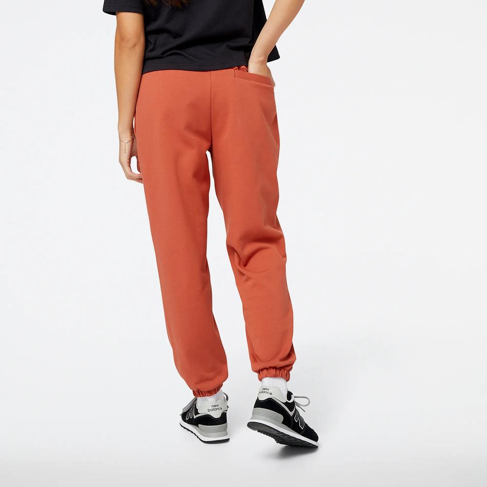 Spodnie New Balance WP23553MHY - brązowe