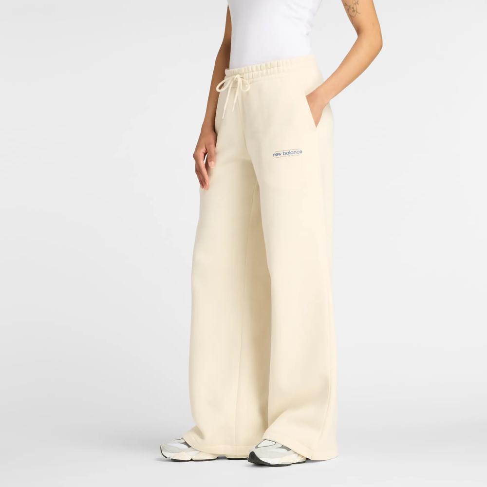 Spodnie damskie New Balance WP53903LIN - beżowe