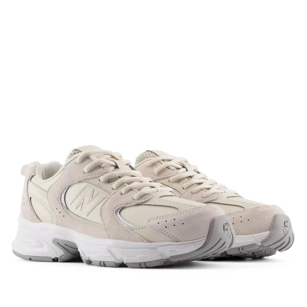 Buty młodzieżowe New Balance G5304V7 - beżowe