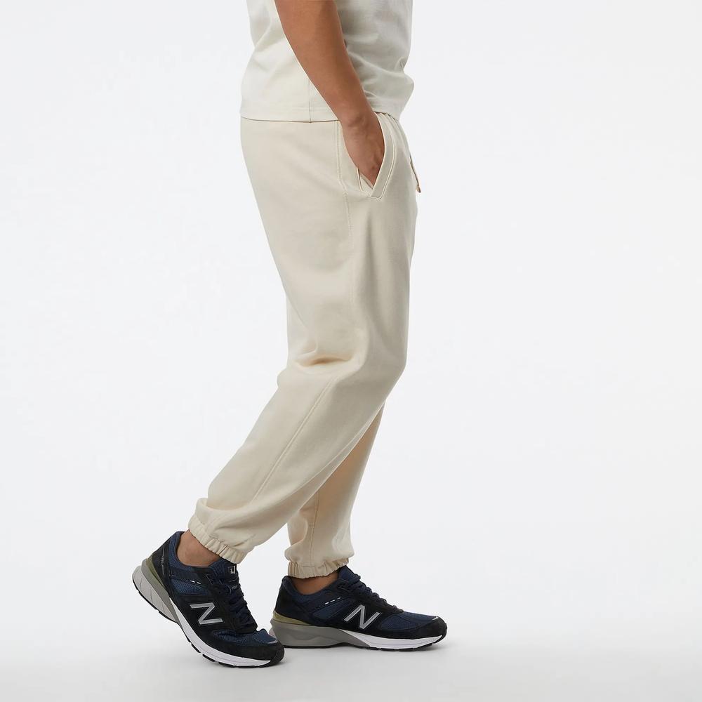 Spodnie dresowe New Balance MP23551GIE - beżowe