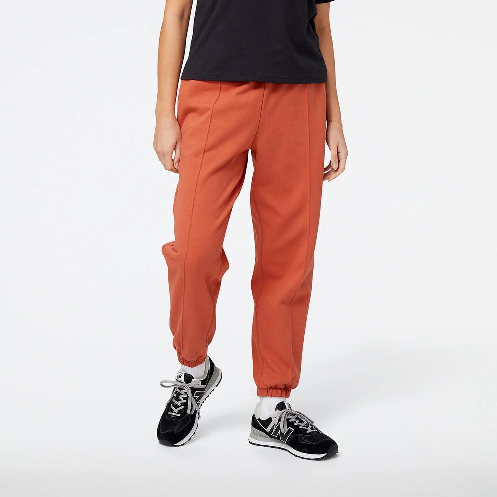 Spodnie New Balance WP23553MHY - brązowe