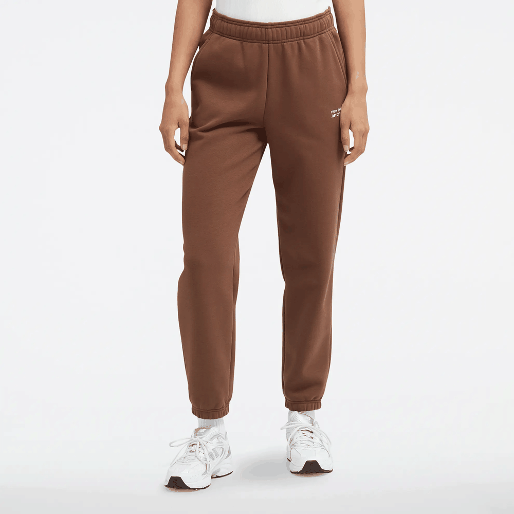 Spodnie New Balance WP33513PNC - brązowe