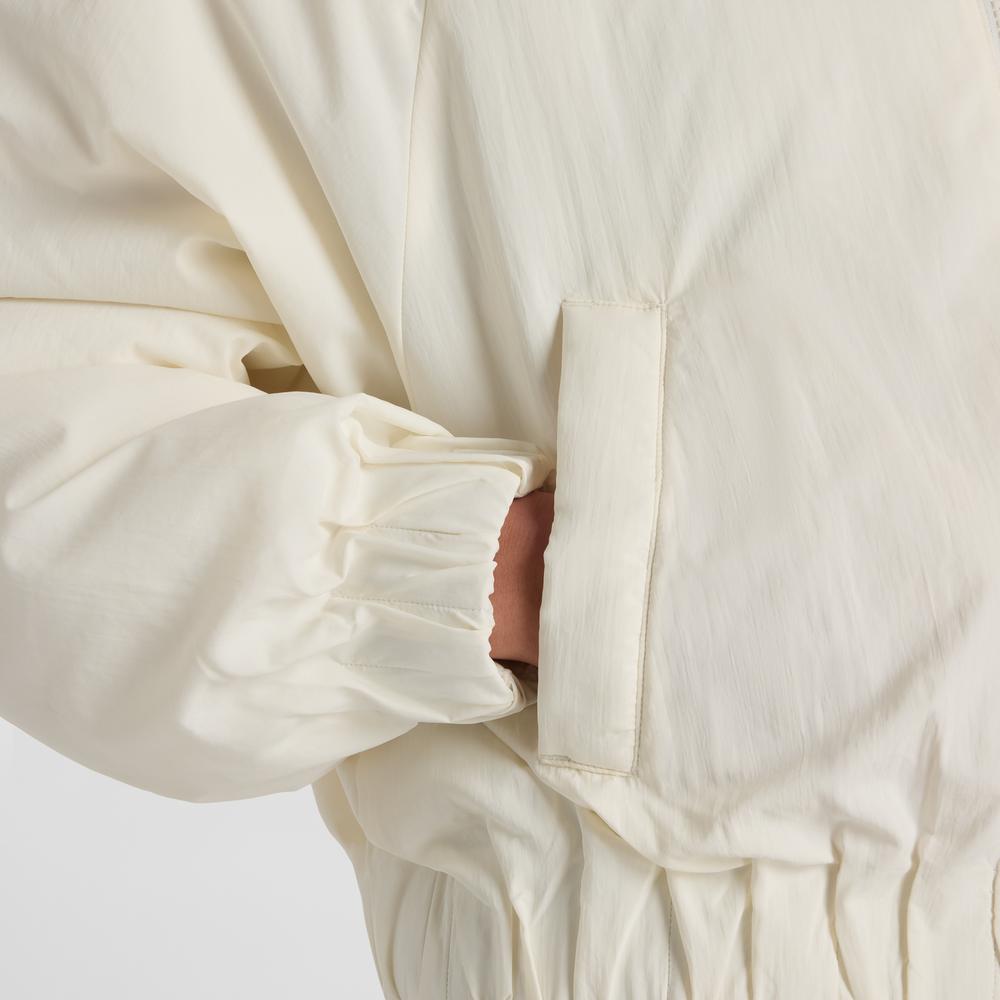 Kurtka damska New Balance WJ61D8YXSST - beżowa