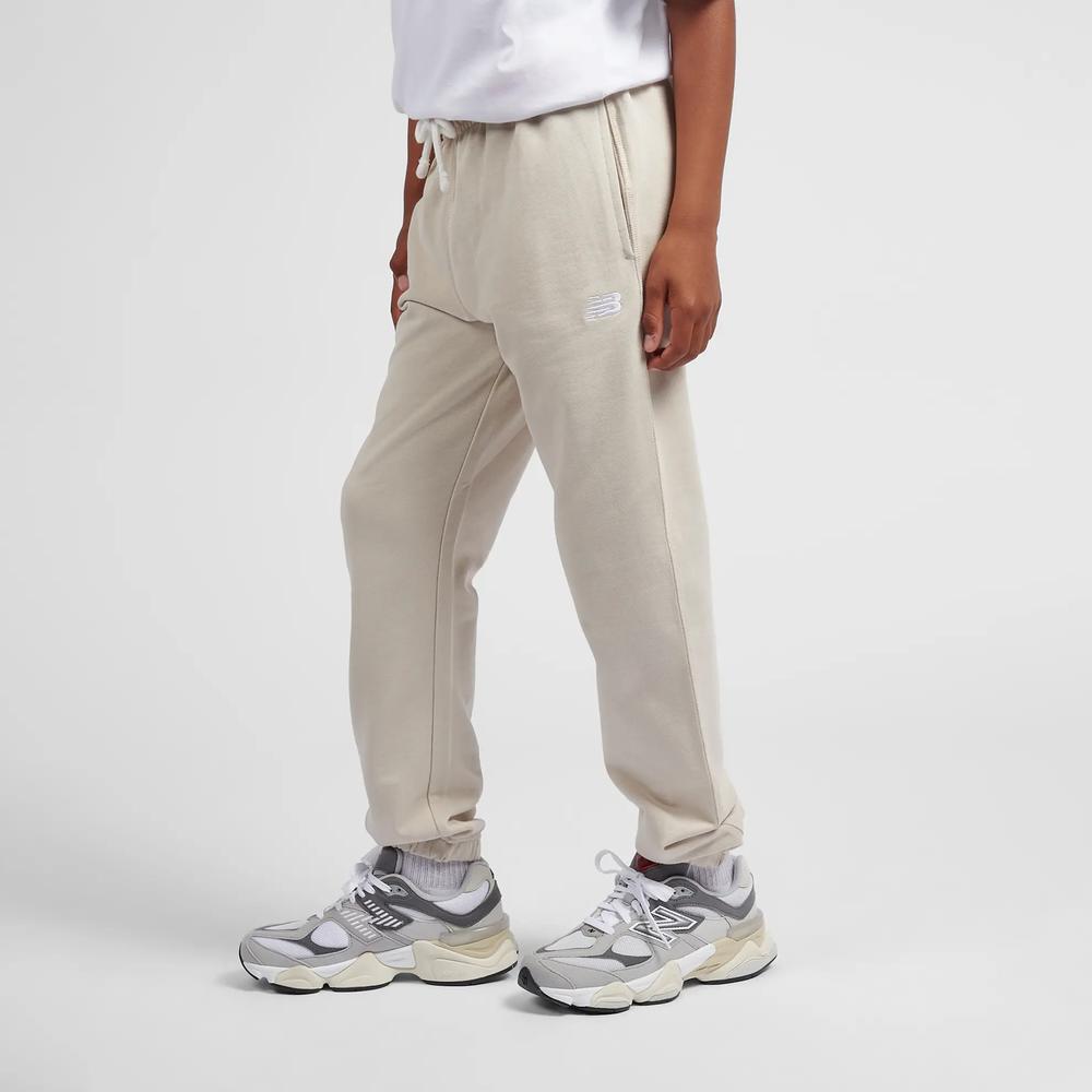 Spodnie dziecięce New Balance LAKB0060TWF - beżowe