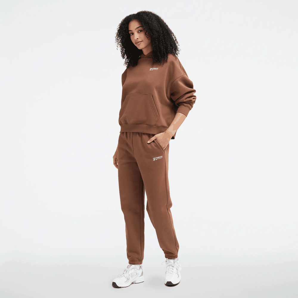 Spodnie New Balance WP33513PNC - brązowe
