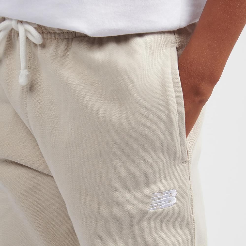 Spodnie dziecięce New Balance LAKB0060TWF - beżowe