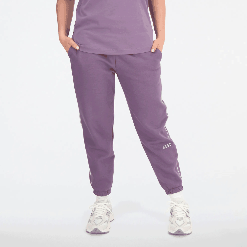 Spodnie New Balance WP33509SHW - fioletowe
