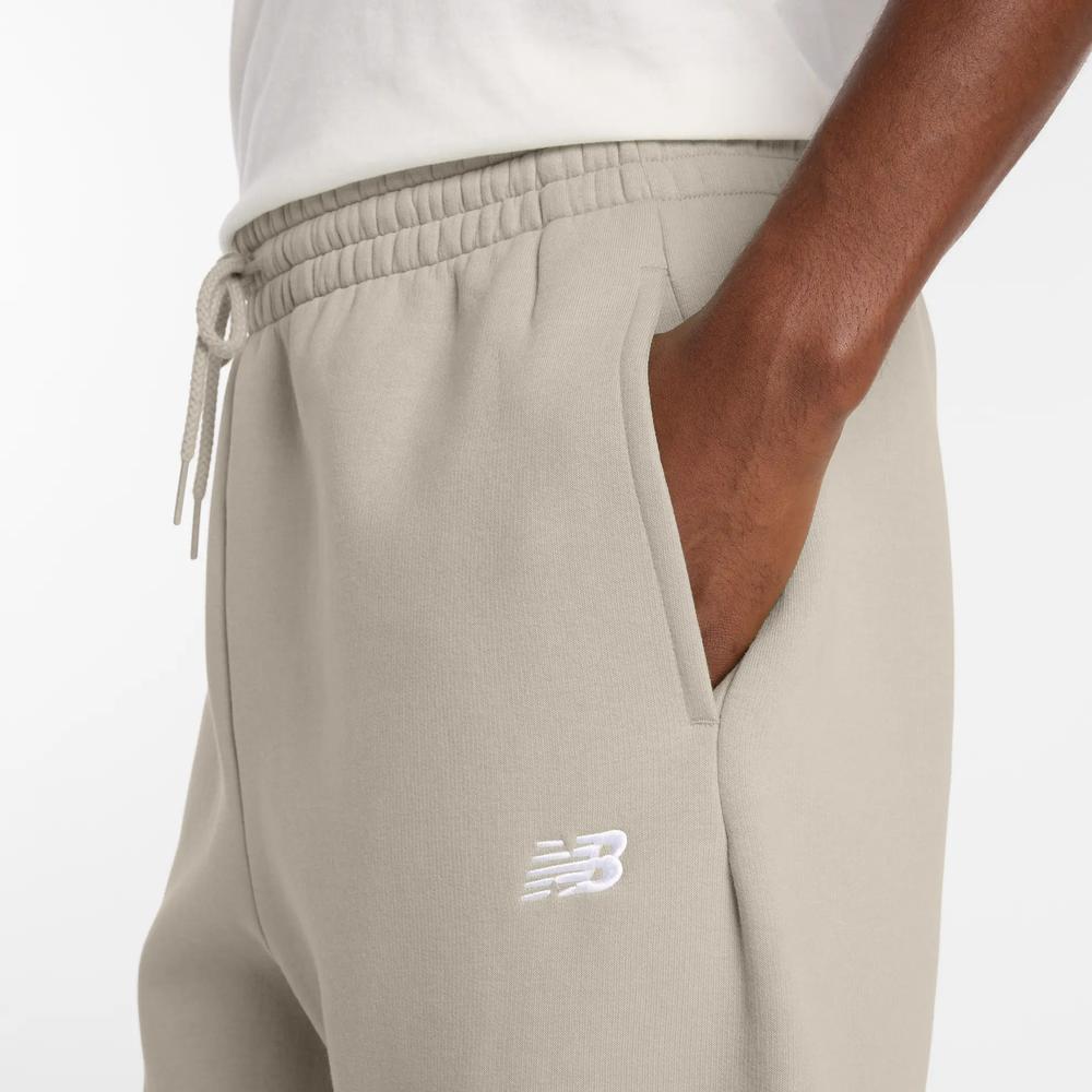 Spodnie męskie New Balance MP41503TWF - beżowe