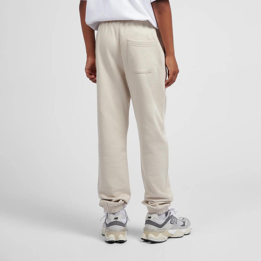 Spodnie dziecięce New Balance LAKB0060TWF - beżowe