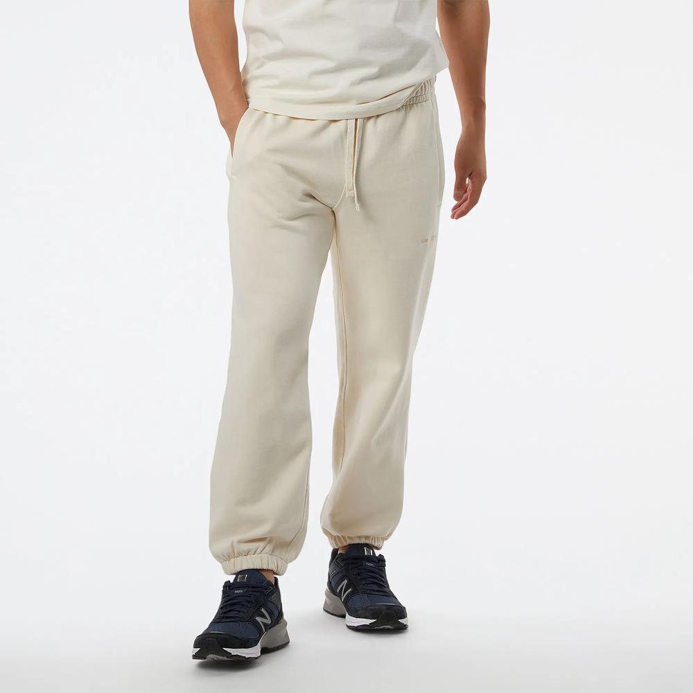 Spodnie dresowe New Balance MP23551GIE - beżowe