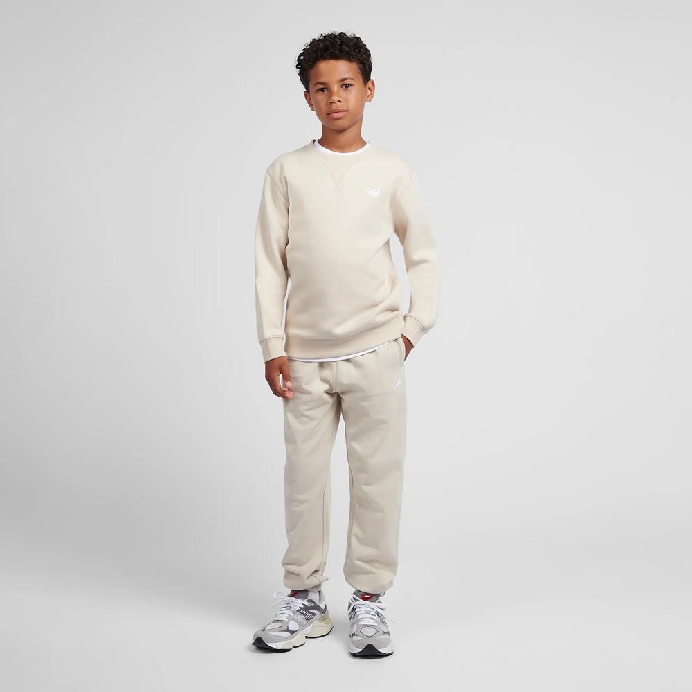 Spodnie dziecięce New Balance LAKB0060TWF - beżowe
