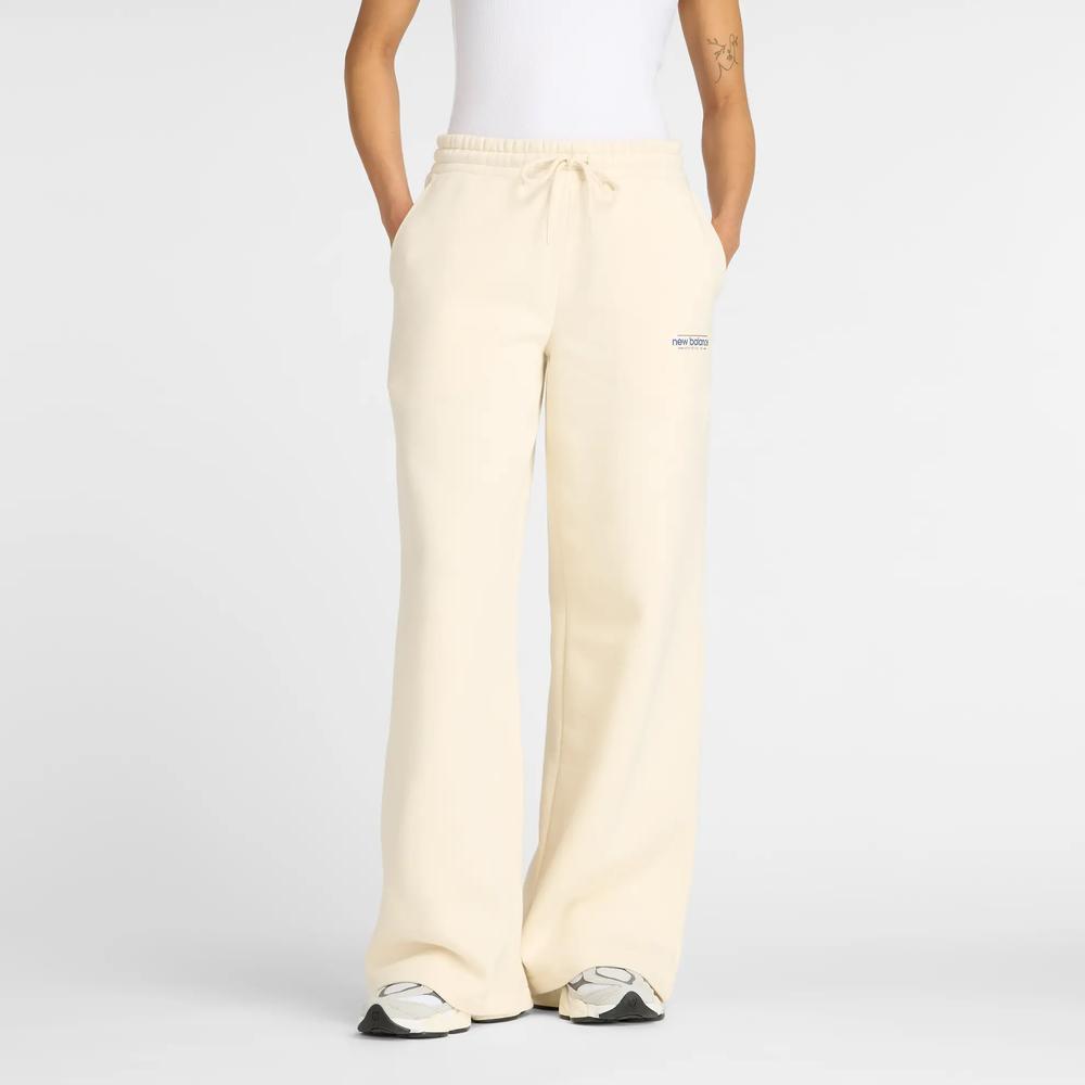 Spodnie damskie New Balance WP53903LIN - beżowe